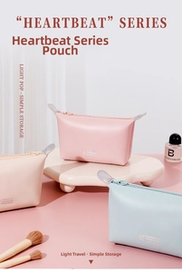 Detailed macro of waterproof PU dumpling cosmetic bags in various pastel macaron colors