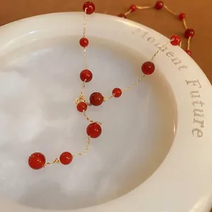Gold plated beaded necklace featuring vintage red agate stones for a luxurious look