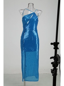 Close-up of bright blue sequins and elegant side slit detail on this slim fit dress