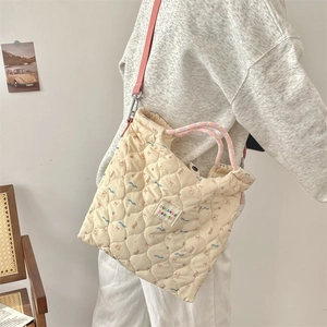 Side view of quilted cotton tote with cartoon bears and adjustable pink shoulder strap