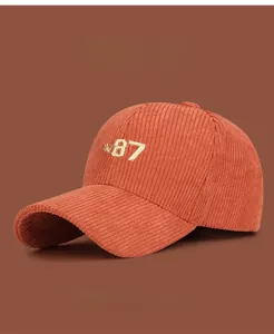 Detailed embroidery of NO 87 on vintage corduroy baseball cap with thick ribbed texture
