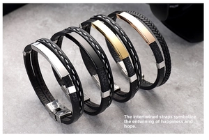 Detail of four woven leather bracelets with silver, black, gold and rose gold metal plates