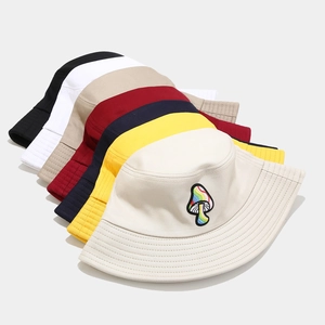 Close-up of colorful mushroom embroidery on a cotton bucket hat in various colors