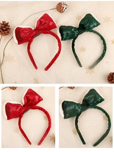 Detail of red and dark green velvet Christmas bow headbands with white plush trim decor