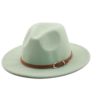 Detailed view of mint green wool fedora hat with brown leather band and gold buckle