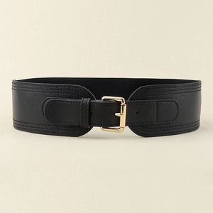 Detail of black elastic wide belt featuring a gold square pin buckle and stitched PU leather