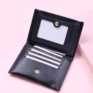 Detailed interior of black leather card holder with card slots and photo window