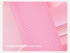 Close-up of pink S-shaped thick breathable honeycomb mesh shoulder straps on backpack