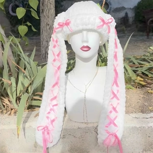Detailed view of white plush knit Balaclava with pink ribbons and bow accents