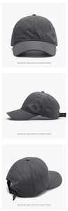 Detail view of dark grey mesh baseball cap showing breathable holes and adjustable strap