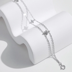Elegant S925 sterling silver double-layer bracelet with sparkling clover charm