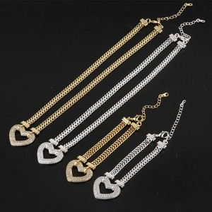 Golden and silver heart necklaces and bracelets with rhinestones in a diagonal layout