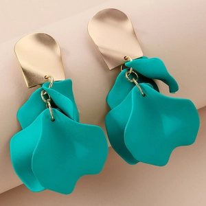 Macro detail of gold metal stud earrings with layered teal acrylic floral petals