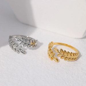 Luxurious gold and silver titanium steel open rings featuring an elegant leaf design