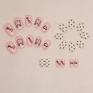 Short square pink and white press-on nails with cute rabbit, polka dots, and Love pattern