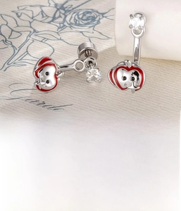 Macro shot of red enamel apple cartilage stud with silver titanium steel back