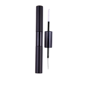 Dual-ended eyelash bond and seal glue applicator brush detail on white background