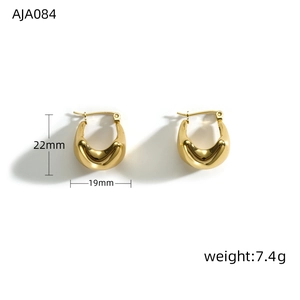 Detail view of gold chubby pea hoop earrings with size 22x19mm and 7.4g weight info