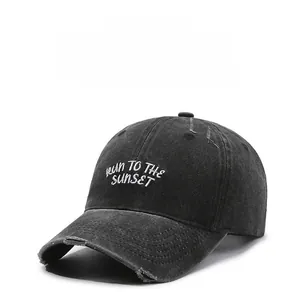 Detail of vintage washed baseball cap featuring worn edges and white letter embroidery