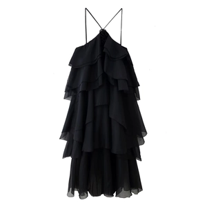 Detail of the multi-layered tiered ruffles and halter neck straps on a black dress