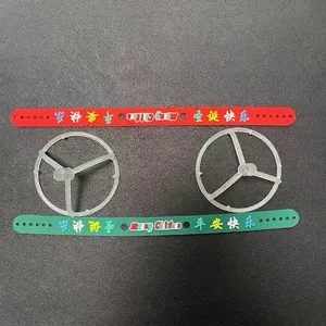 Red and green Christmas silicone bracelets with Merry Christmas text and plastic holders