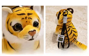 Detail of plush tiger keychain featuring soft fabric texture and woven brand tag