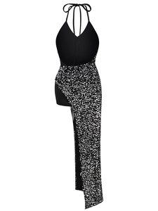 Detail of black sequined halter dress featuring asymmetric silver hem and open back tie
