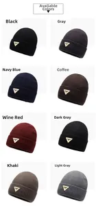 Detail of ribbed knit beanies in multiple colors with metallic triangle logo patch