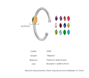 Detail of twisted cable cuff bracelet with green marquise zircon and colorful options