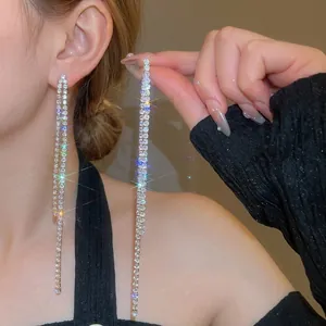 Elegant long silver tassel earrings with sparkling zircon crystals in a linear design
