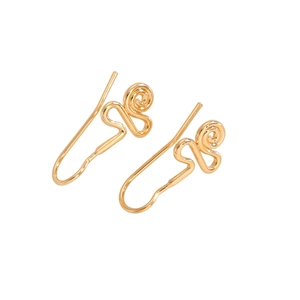 Detailed close-up of golden spiral wire earrings with minimalist metal hook design