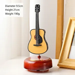 Miniature yellow guitar music box on wood base, dimensions 9.5x21cm for home decor