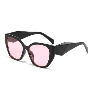 Chic cat eye oversized sunglasses with geometric black frame and pink lenses