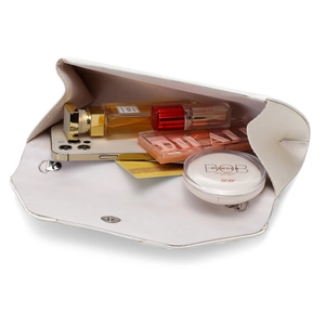 Interior view of ivory satin clutch bag showing capacity for phone, perfume and cosmetics