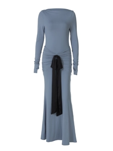 Detail view of smog blue pleated waist dress with long sleeves and thumb hole design