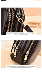 Detail of the reinforced handle and gold electroplated hardware on the black PU crossbody bag