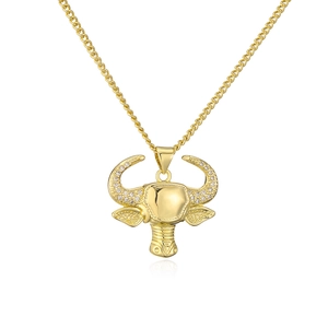 Detail of 18K gold plated bull head pendant with cubic zirconia on a Cuban chain
