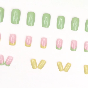 Press-on nail set in fresh mint green, lemon yellow, and pink french contrast design
