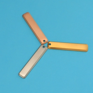 Detailed view of rectangular stainless steel bar pendants in rose gold, gold, and silver