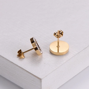 Elegant gold round stud earrings with shimmering zircon inlay on textured stone base