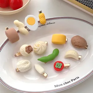 Creative 3D food-shaped hair clips including buns and fried eggs on a white plate