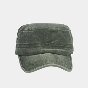 Detail of washed cotton fabric and stitching on a dark grey-green army cadet cap