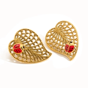 Golden stainless steel heart-shaped earrings with red enamel ladybug on white background