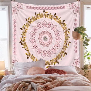 Detailed view of bohemian pink mandala tapestry hanging as a cozy bedroom headboard