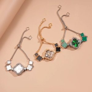 Detail view of flower-shaped quartz watches with sparkling crystals and adjustable pull chains