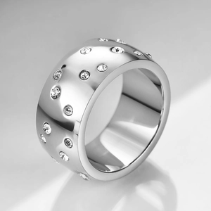 Detailed side view of 10mm stainless steel wide ring with sparkling cubic zirconia inlay