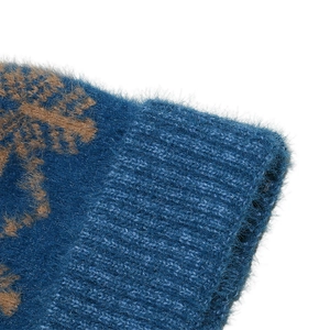 Macro detail of navy blue plush knit beanie showing soft mohair texture and ribbed edge