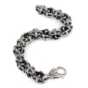 Vintage gothic cross bracelet for men made of oxidized stainless steel on white background
