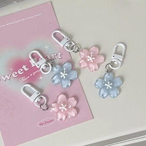 Romantic translucent cherry blossom petal keychains in pink and blue colors