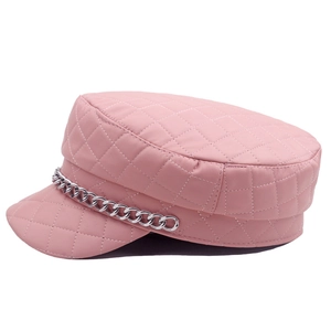 Detailed view of pink quilted leather baker boy hat with silver metal chain
